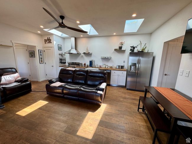Living area featuring wood-type floors and recessed lighting, new leather couch & loveseat | Image 5
