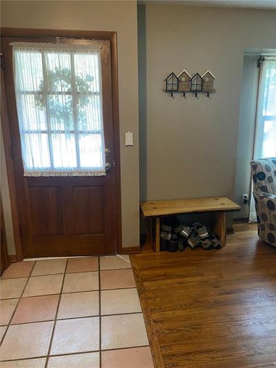 Doorway to outside with tile patterned floors | Image 3