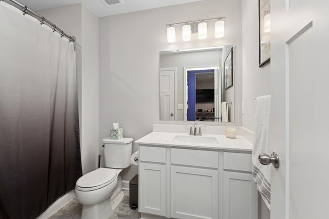 Adjacent bath supports the lower level of this home. | Image 21