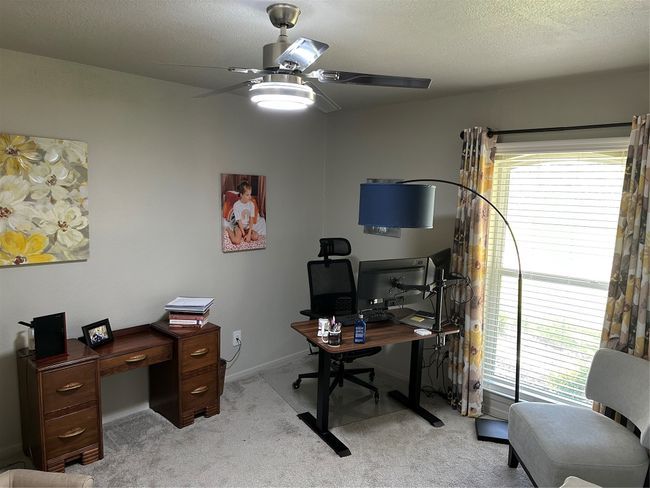 Office with a ceiling fan, plenty of natural light, light carpet, and a textured ceiling | Image 18