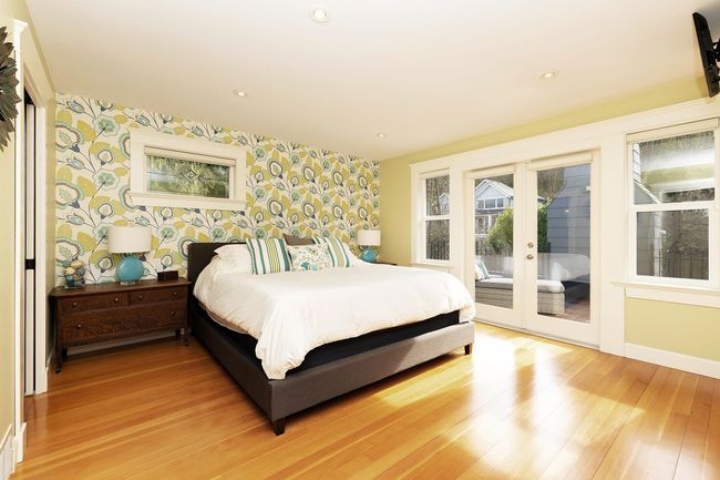 Bedroom with french doors, access to outside, light wood-style flooring, and wallpapered walls | Image 11