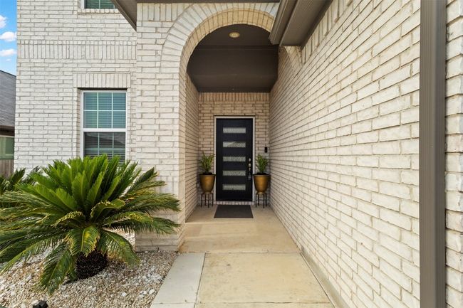 Doorway to property with brick siding | Image 30