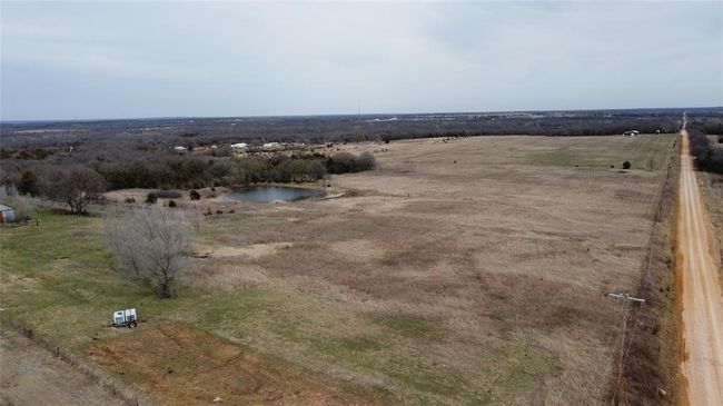 Birds eye view of property featuring a rural view and a water view | Image 42