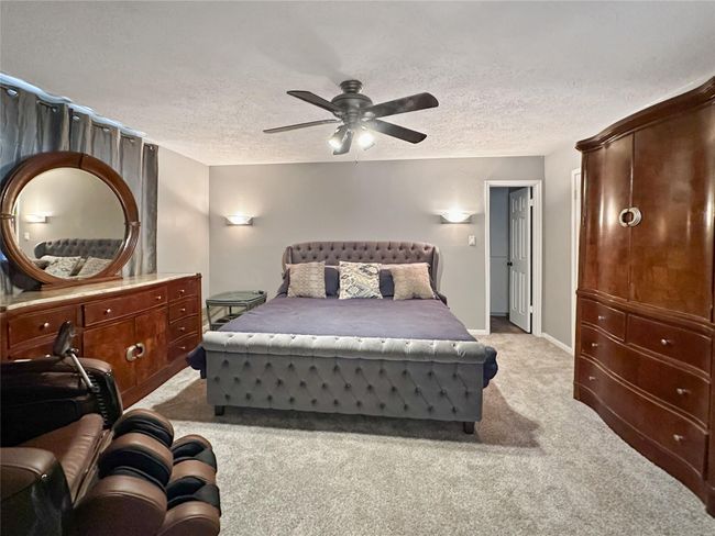 Primary bedroom is located downstairs and offers three (3) closets! | Image 9