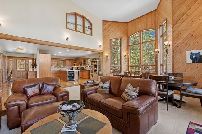 Living area featuring high ceiling | Image 44