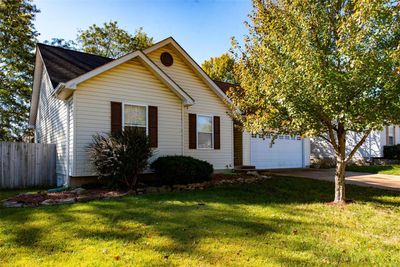 View of front featuring a garage and a front lawn | Image 3