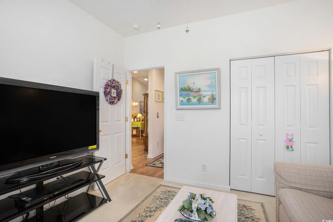 Living area featuring light wood-type flooring and baseboards | Image 15