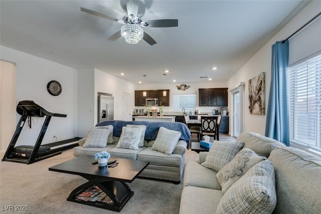 Living room featuring recessed lighting, light carpet, and ceiling fan | Image 4