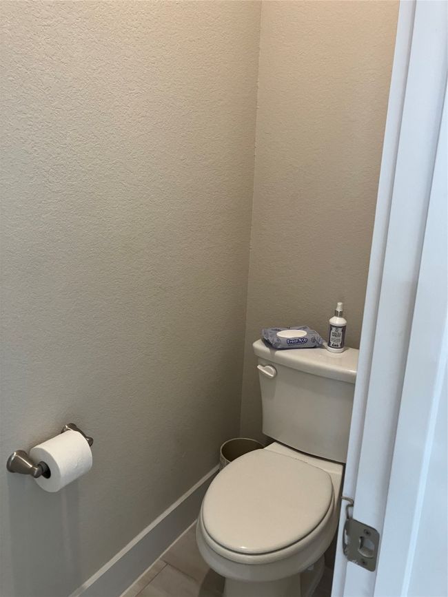 Bathroom featuring toilet and baseboards | Image 15