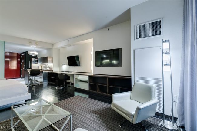 Living room with wood finished floors | Image 17
