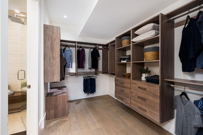 Spacious closet with hardwood / wood-style flooring | Image 26