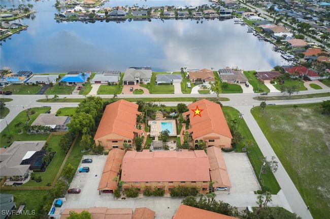 Aerial view of residential area featuring a large body of water | Image 39