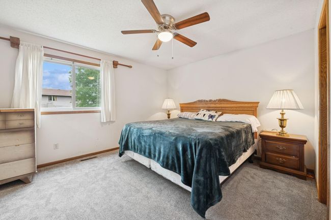 The primary bedroom features great natural light. | Image 11