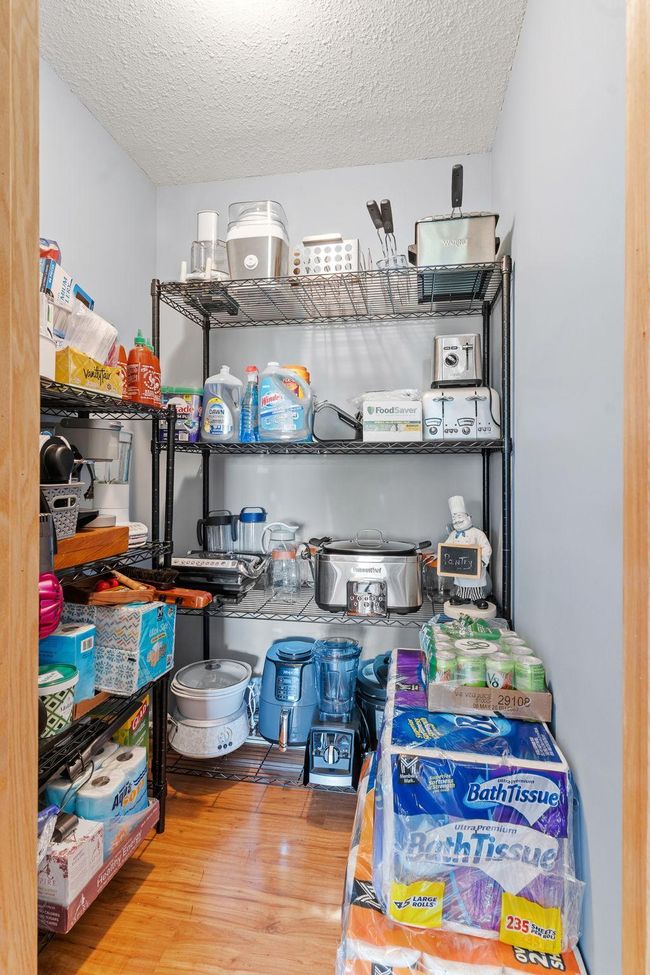 Great storage around the corner from the steps downstairs. | Image 42