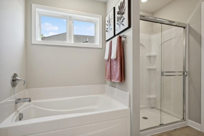 (Photo of model home, actual features may vary) The owner's suite bathroom allows you to relax in your private oasis. | Image 11