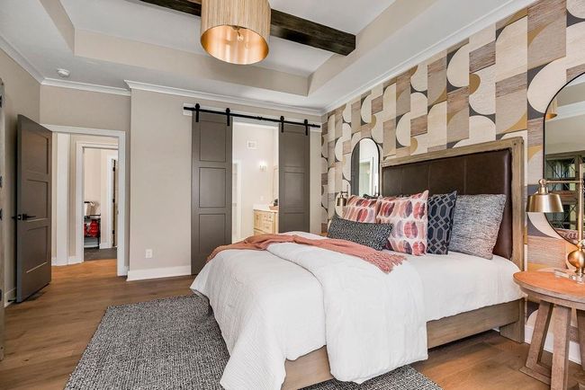 Primary En-Suite with tall ceiling and window to the back yard. Photos of previous model home. Not actual listing. Features and sizes may vary. Contact agent for details & showings! | Image 15