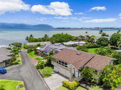 Gorgeous custom home in the Ko'olau Vista subdivision provides deeded ocean access to all 8 homes on this private lane. The underground electricity and deeded view corridors ensure that this home maintains an unobstructed panoramic view of Kaneohe Bay and the Ko'olau Mountains. This home is situated to have one of the best views on the lane. | Image 2