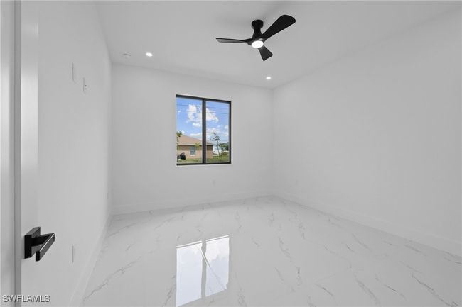 Unfurnished room with marble finish floors, baseboards, recessed lighting, and ceiling fan | Image 21