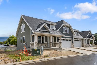 Craftsman inspired home with a porch and a garage | Image 2