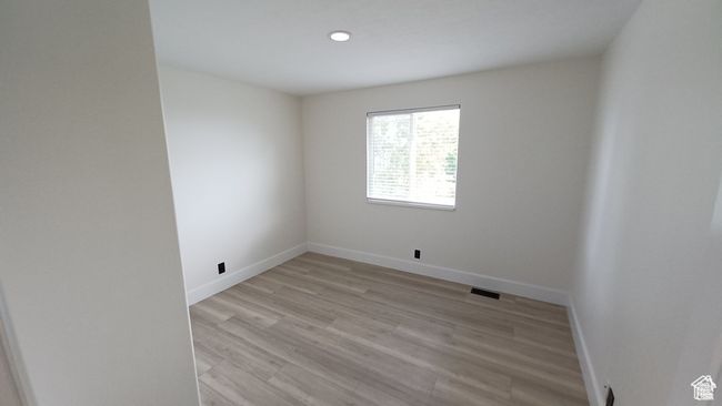 Spare room with light wood-style floors and recessed lighting | Image 17