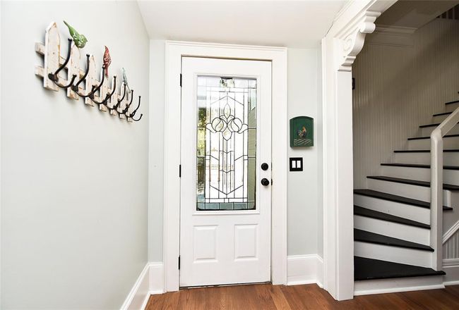 The front door to the Guest House. The corbols add so much charm to this very modern old home. | Image 33