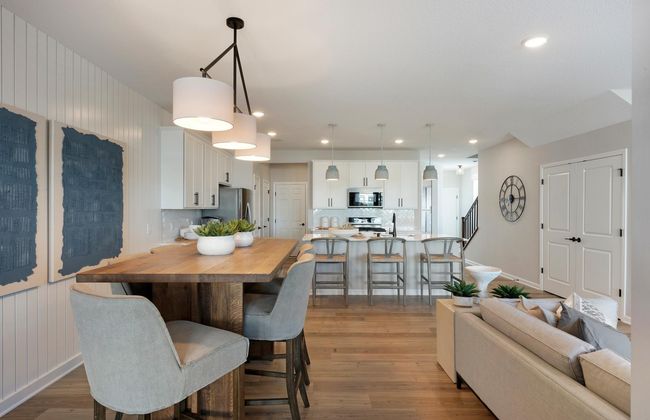 Conveniently located off the kitchen we find the dining room! Perfectly sized to accommodate any table or set up you could want! Photo of model home. | Image 8