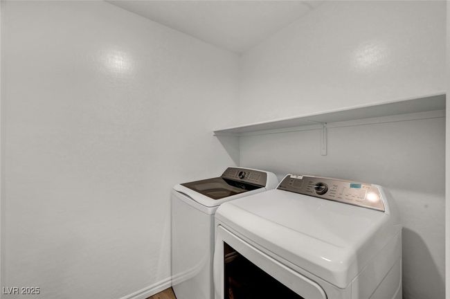 Washroom featuring washer and dryer and laundry area | Image 19
