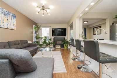 235 Huntersfield Dr, Townhouse with 3 bedrooms, 4 bathrooms and 3 parking in Ottawa ON | Image 2