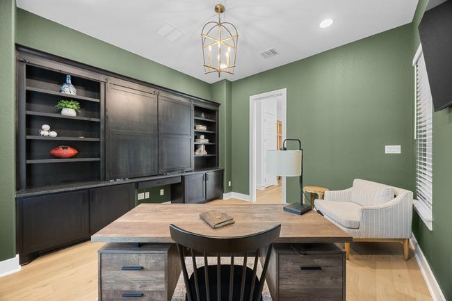 Office area featuring light wood-style floors, a chandelier, and recessed lighting | Image 13