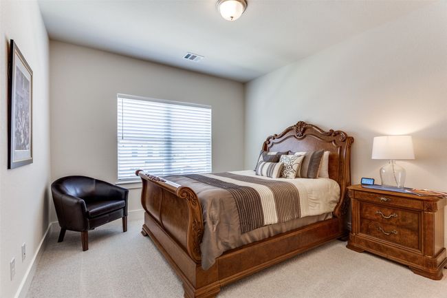 Bedroom with light colored carpet and baseboards | Image 30