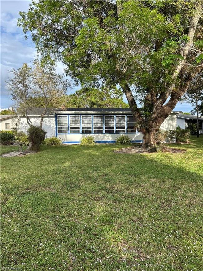 Back of property featuring a lawn | Image 17