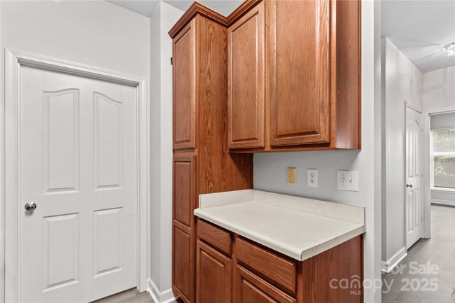 Laundry utility room located off kitchen | Image 14