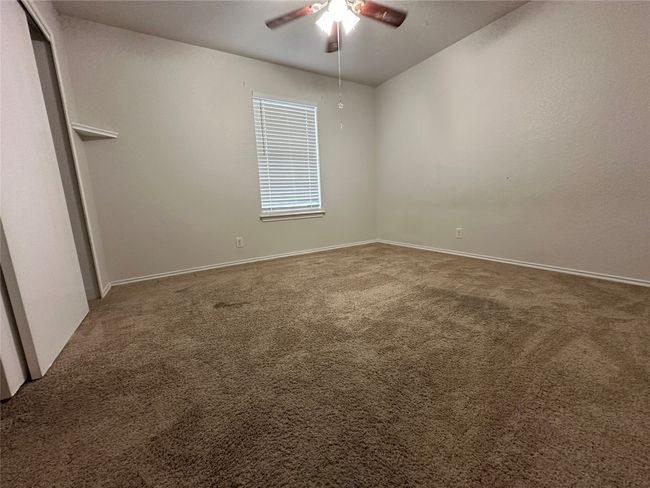 Unfurnished room featuring ceiling fan and carpet flooring | Image 23
