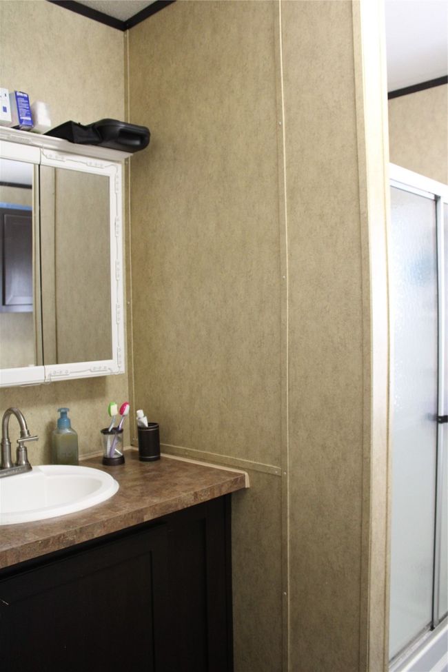 Bathroom with vanity, ornamental molding, and a stall shower | Image 25
