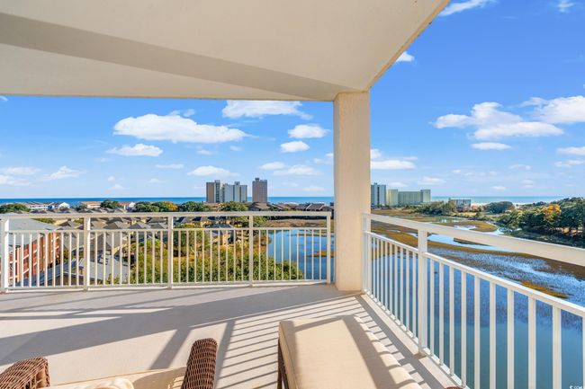 Balcony featuring a water view | Image 13