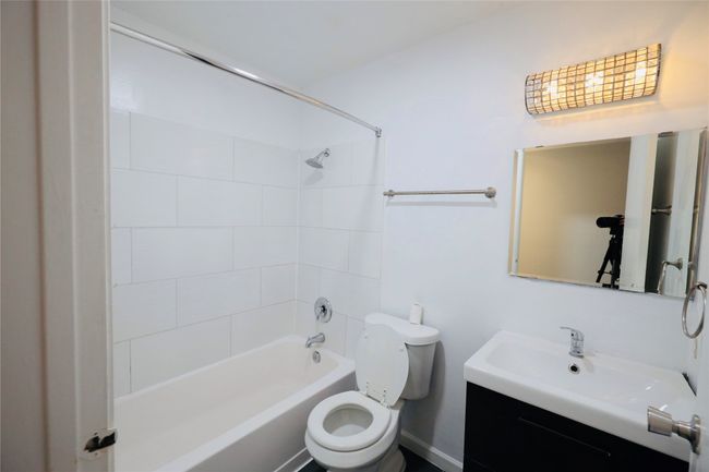 Bathroom with shower / bathtub combination and vanity | Image 19