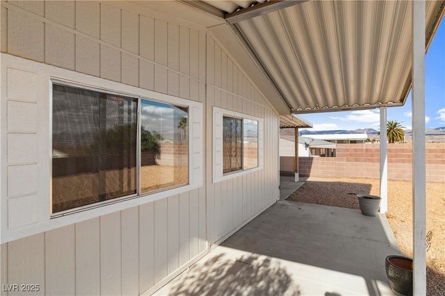 View of back covered patio with view. | Image 41