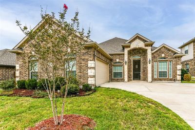 View of front of property with a front yard and a garage | Image 2