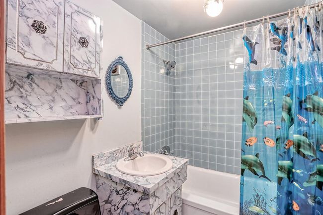 Full bath featuring shower / bath combination with curtain and vanity | Image 22