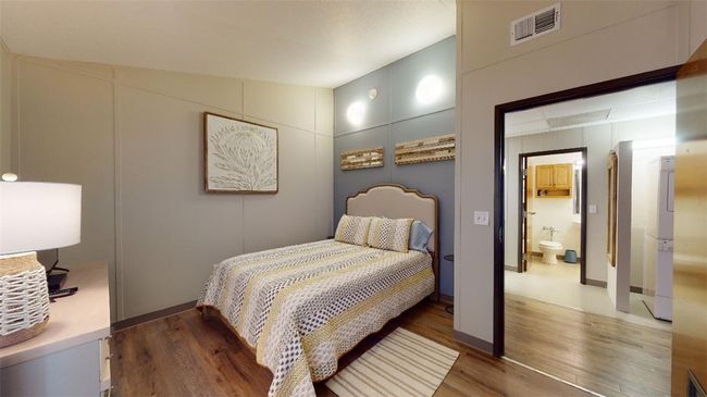 Bedroom featuring wood finished floors | Image 32