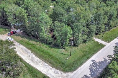 This wooded corner lot in subdivision Lake Livingston Village. This undeveloped lot is ready for you to build your dream home. | Image 1