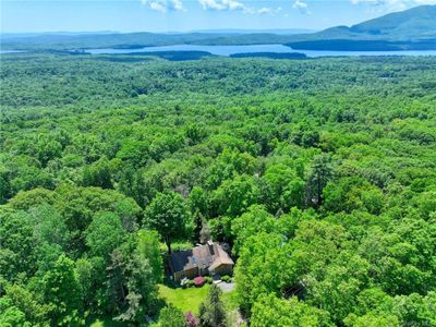 Bird's eye view with a water and mountain view | Image 1