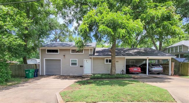 Dual 1-bedroom guest suites offer versatile living options and rental income potential. Enjoy ample storage and a convenient 2-car carport for your home | Image 38