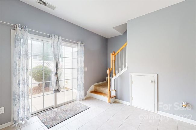 Sliding door out to the fenced patio | Image 13