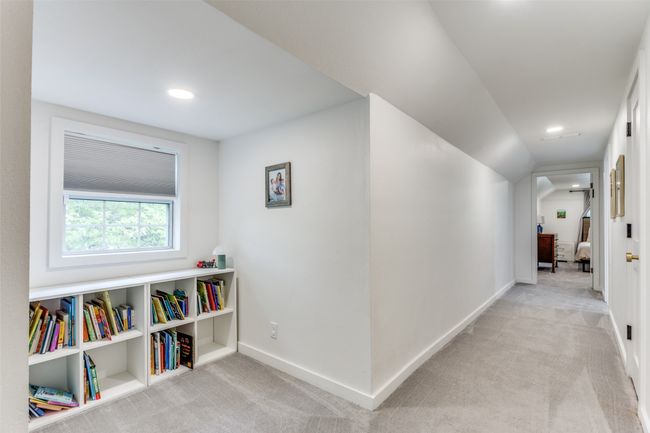 Upstairs hall with reading nook. | Image 20