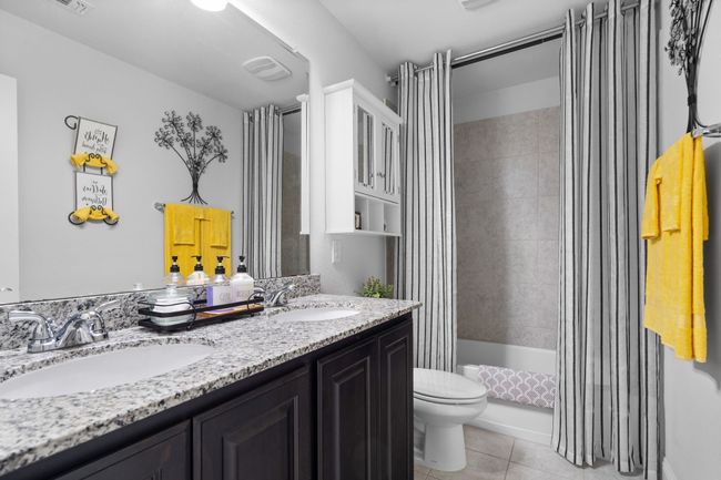 Modern guest bath with a convenient shower-tub combination! | Image 21