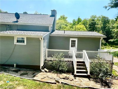 Back of house featuring a wooden deck | Image 2