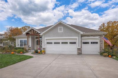 Craftsman-style home with a garage | Image 2