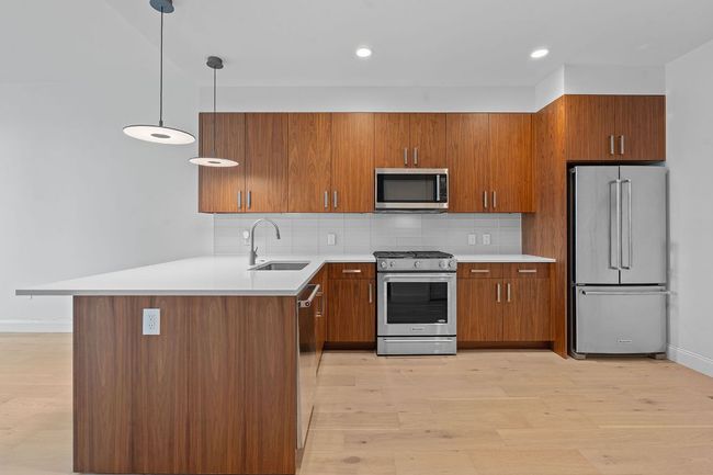 Awaken to your wonderful city views, ceiling fan for comfort. Tall ceilings. Bright and airy. | Image 9