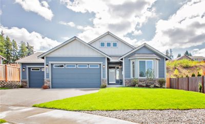 The Pine , under construction on 9814 Brooklyn Lane SE (lot 200) offers 4 beds + bonus, 3 baths, 2457 sq ft plus 3 car garage. Complete in Dec. 2024 Photo from similar plan on different lot for reference only | Image 1